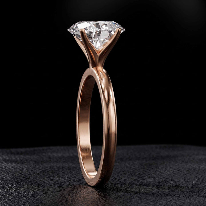 2.2 Ct oval solitaire moissanite engagement ring in 18K gold.