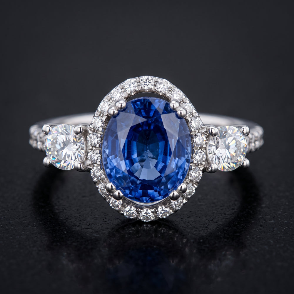 Stunning 14K Gold Oval Blue Sapphire Ring with Halo and Side Stones