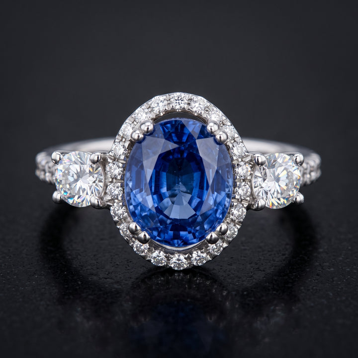 Stunning 14K Gold Oval Blue Sapphire Ring with Halo and Side Stones