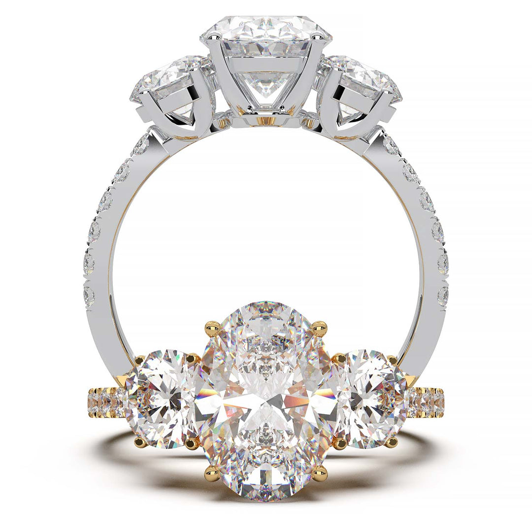 Three-stone engagement ring with 2-carat oval lab-grown diamond, round side stones, and pave band