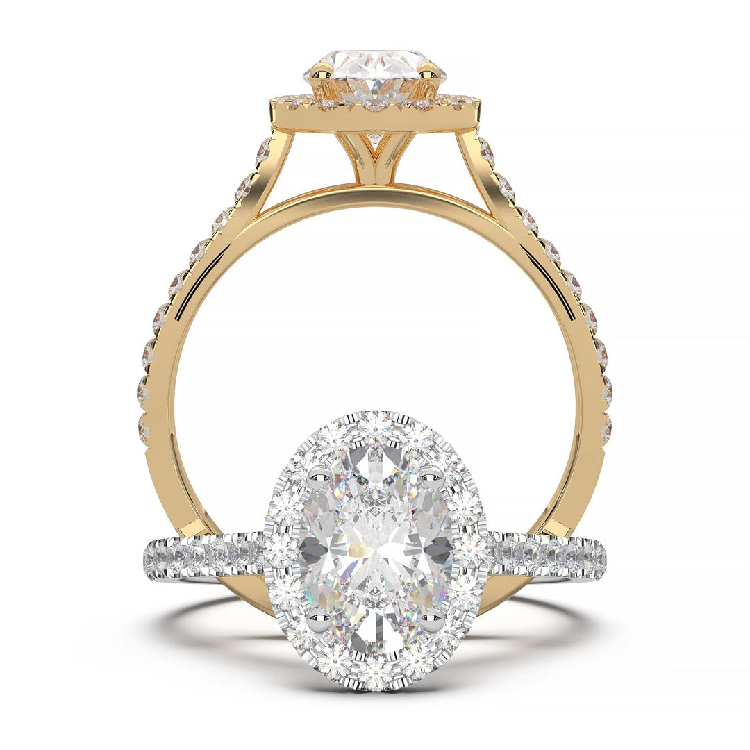 Oval lab-grown diamond halo engagement ring with pavé diamonds on the band in a cathedral setting.
