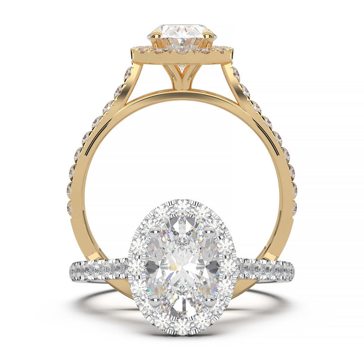 Oval lab-grown diamond halo engagement ring with pavé diamonds on the band in a cathedral setting.