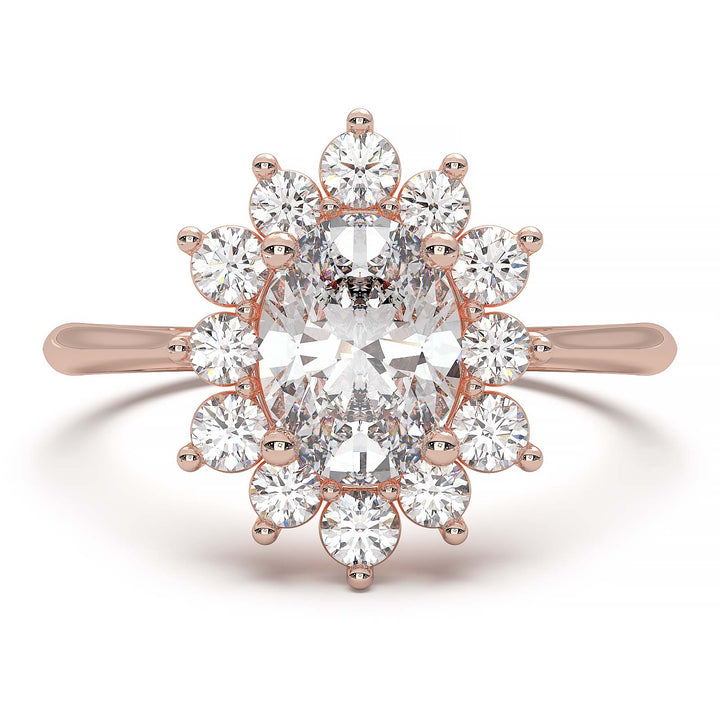 Oval lab-grown diamond ring with a sunburst halo of small diamonds in a low-profile setting.