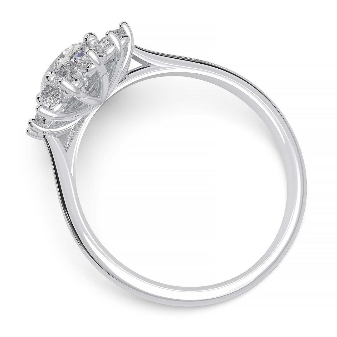 Oval lab-grown diamond ring with a sunburst halo of small diamonds in a low-profile setting.