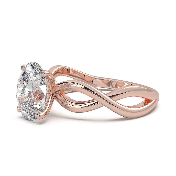 Oval lab-grown diamond ring with a twisted band and low-profile setting.