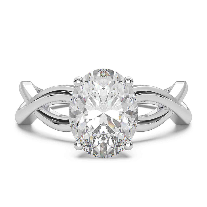 Oval lab-grown diamond ring with a twisted band and low-profile setting.