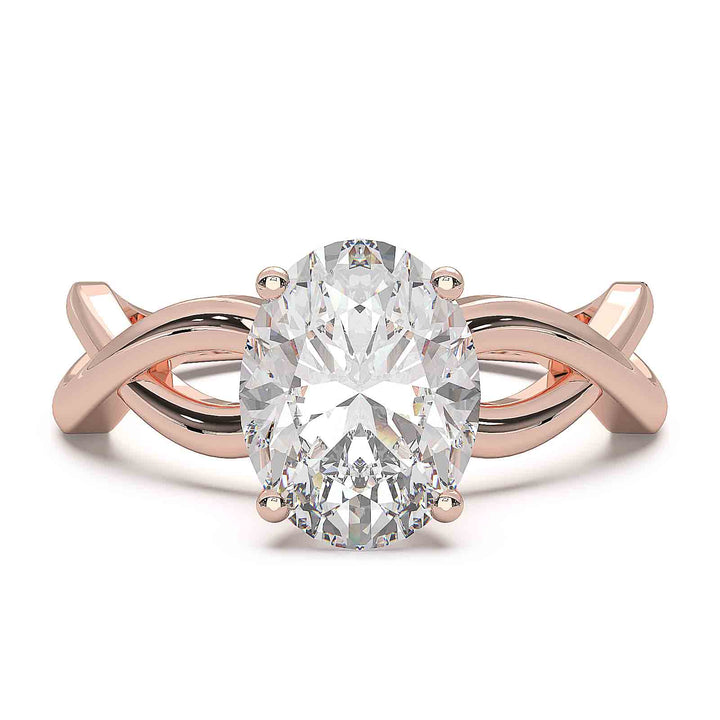 Oval lab-grown diamond ring with a twisted band and low-profile setting.