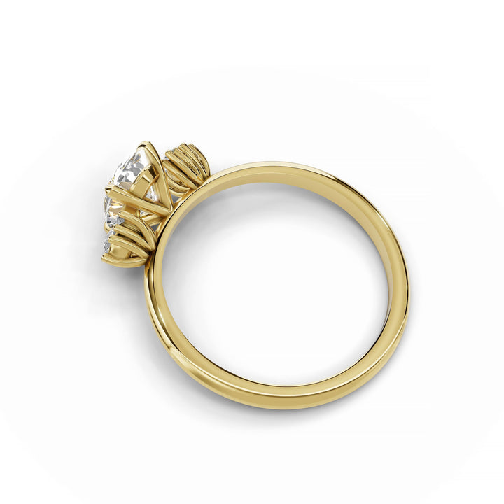 Oval diamond cluster engagement ring in yellow gold.