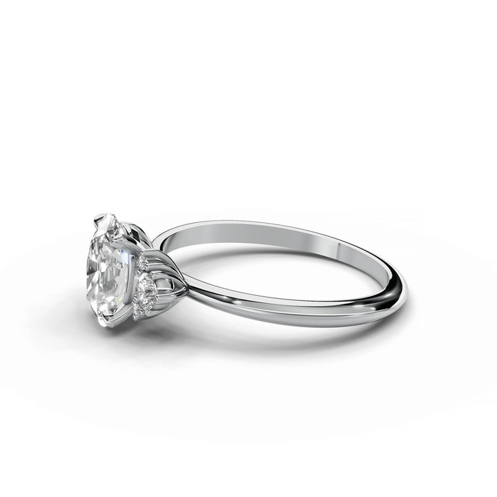 Oval diamond cluster engagement ring in white gold.