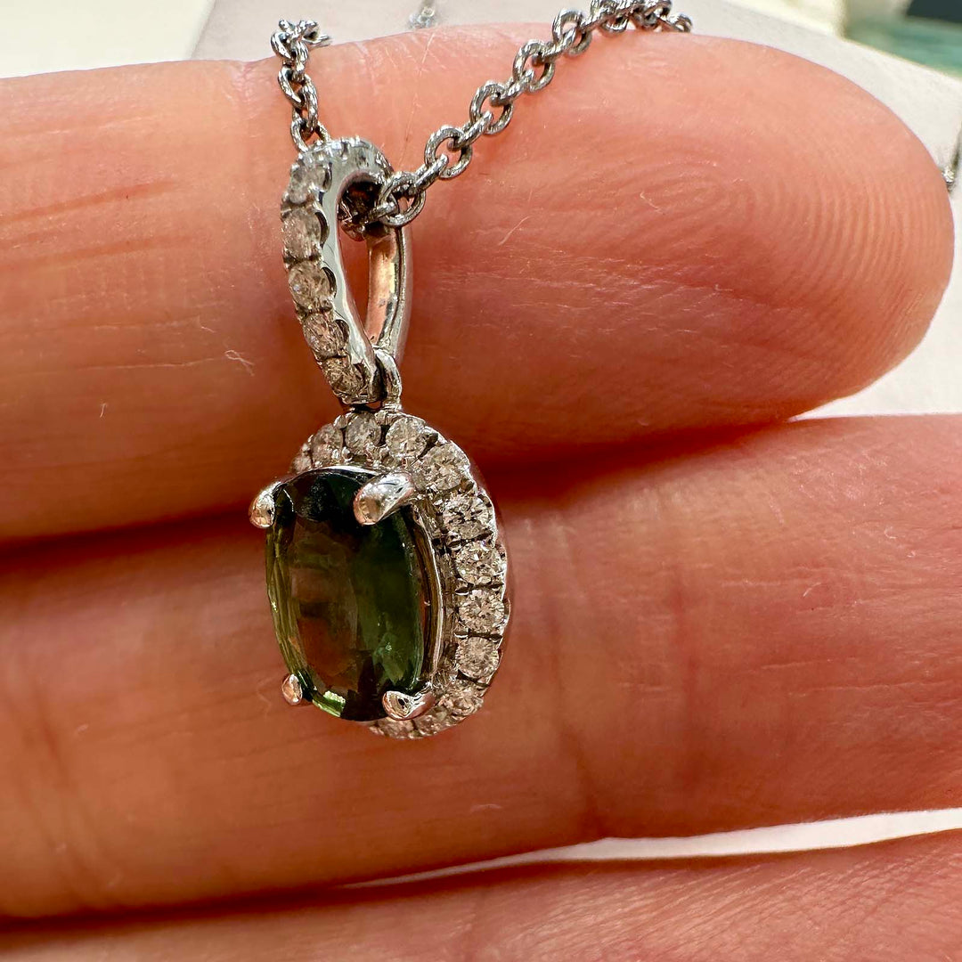 Natural oval green sapphire pendant with diamond halo in 14k white gold, 1.06ct sapphire with 0.23ct diamonds.