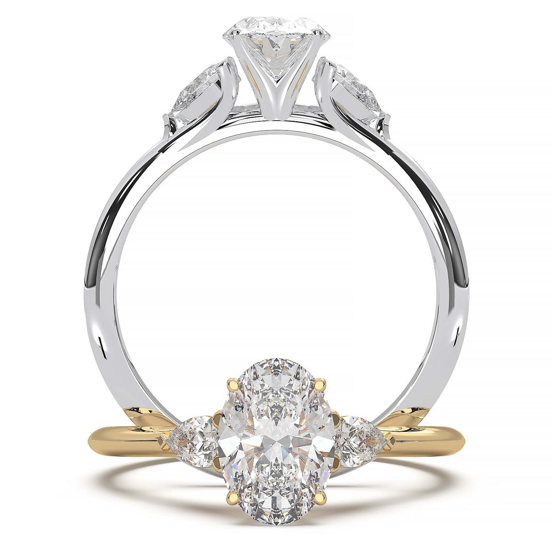 engagement ring featuring a 1 carat oval lab-grown diamond with pear-shaped side stones, held by unique cathedral-inspired prongs