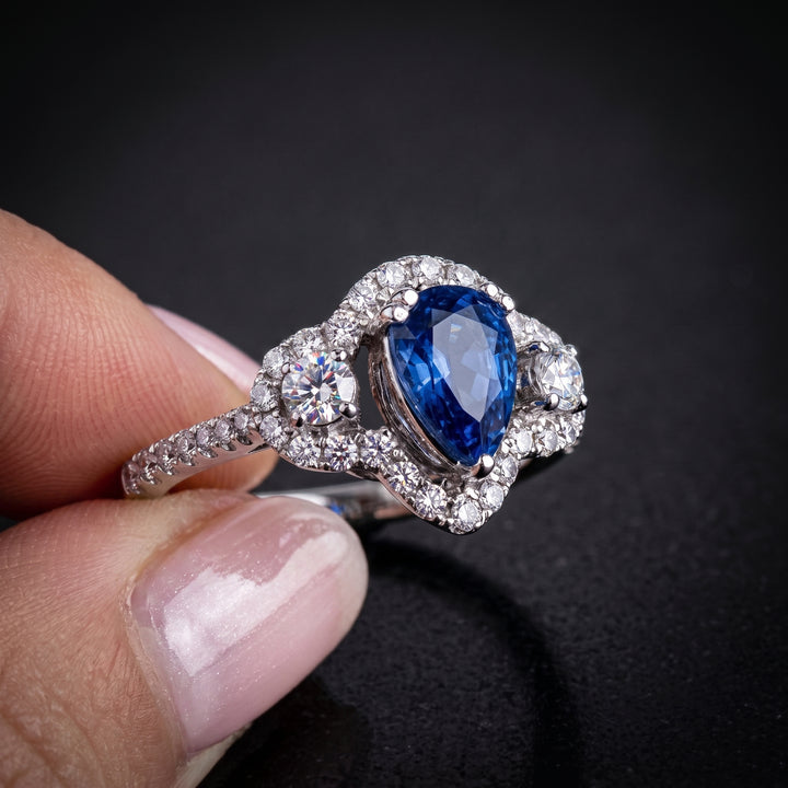 Dazzling 14K Gold Pear-Shaped Sapphire Ring with Halo and Side Diamonds