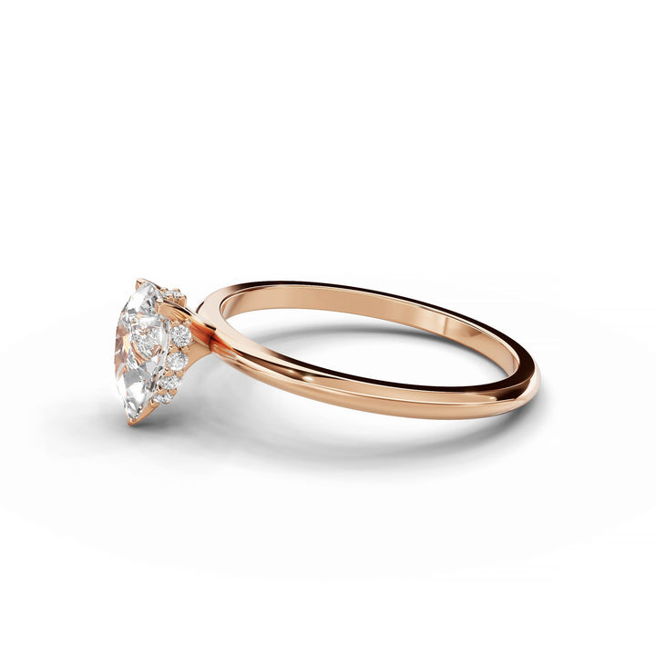 Pear-shaped diamond engagement ring in rose gold.
