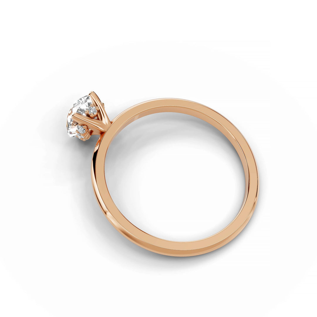 Pear-shaped diamond engagement ring in rose gold.