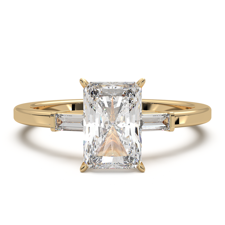 Radiant cut three stone engagement ring with tapered side diamonds.