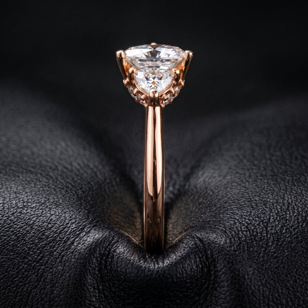 Radiant-cut moissanite ring with trillion side stones set in 14K yellow gold.
