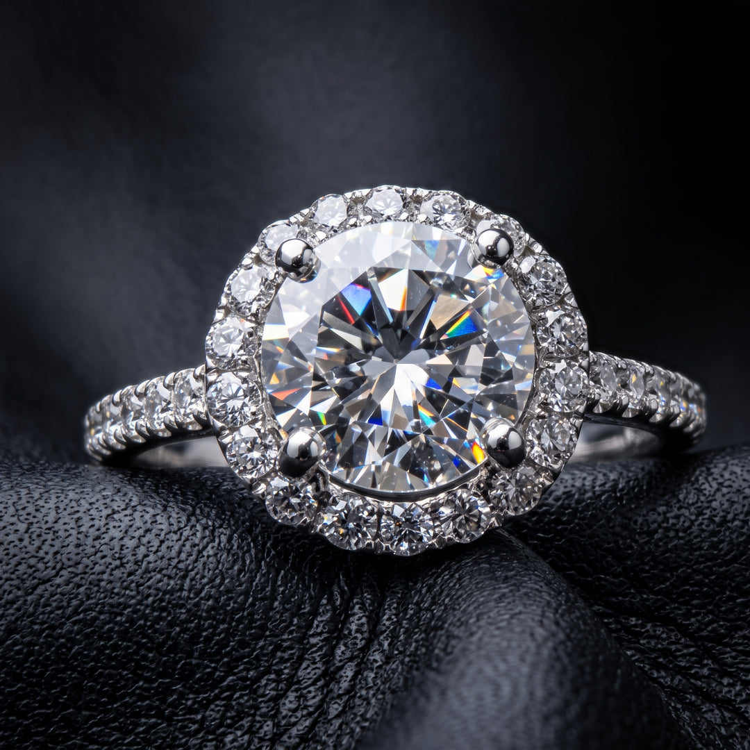 1 CT round moissanite engagement ring with hidden halo and diamonds in 14K gold.