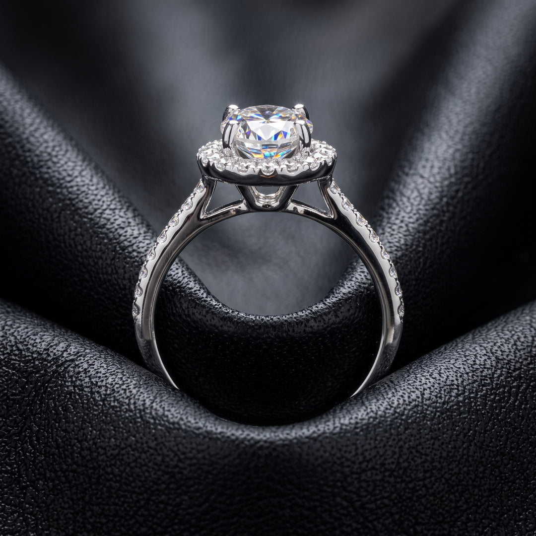 1 CT round moissanite engagement ring with hidden halo and diamonds in 14K gold.