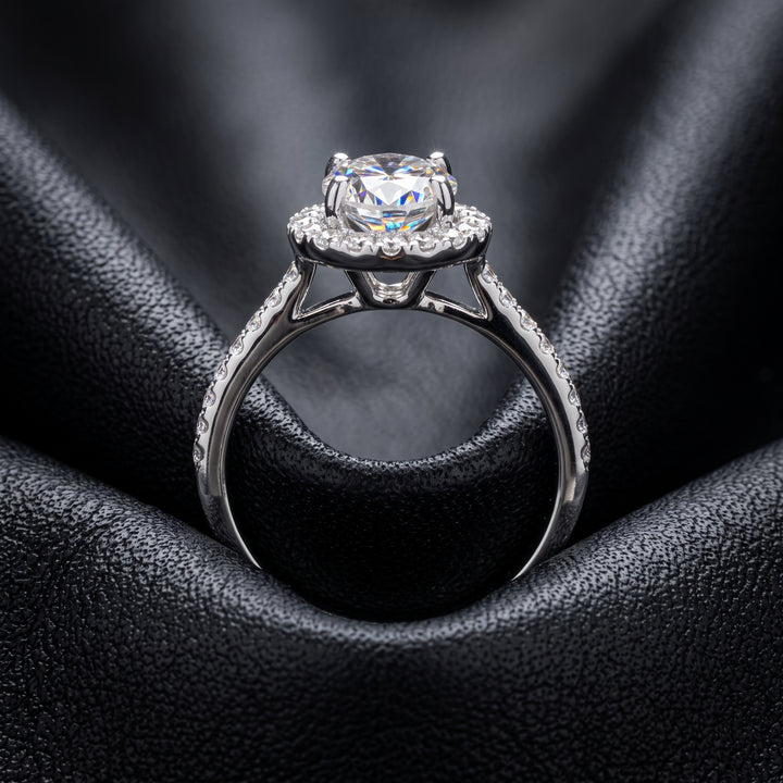 1 CT round moissanite engagement ring with hidden halo and diamonds in 14K gold.