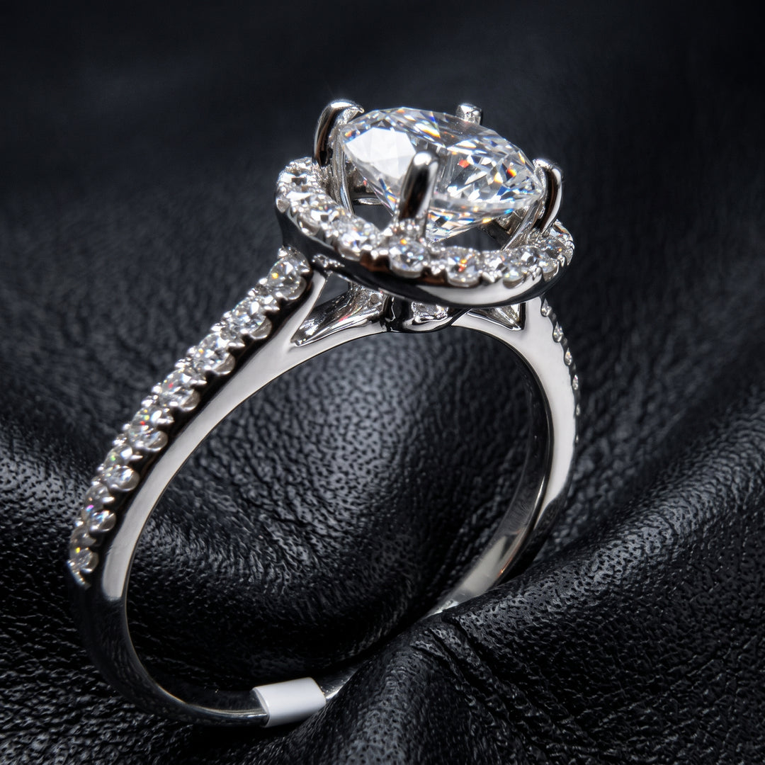 1 CT round moissanite engagement ring with hidden halo and diamonds in 14K gold.