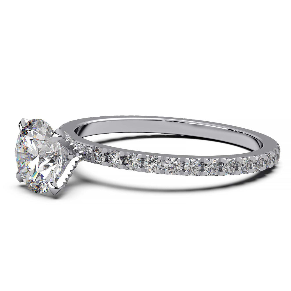 0.9 carat round lab-grown diamond engagement ring with pave-set diamonds on the band and additional small diamonds on prongs.