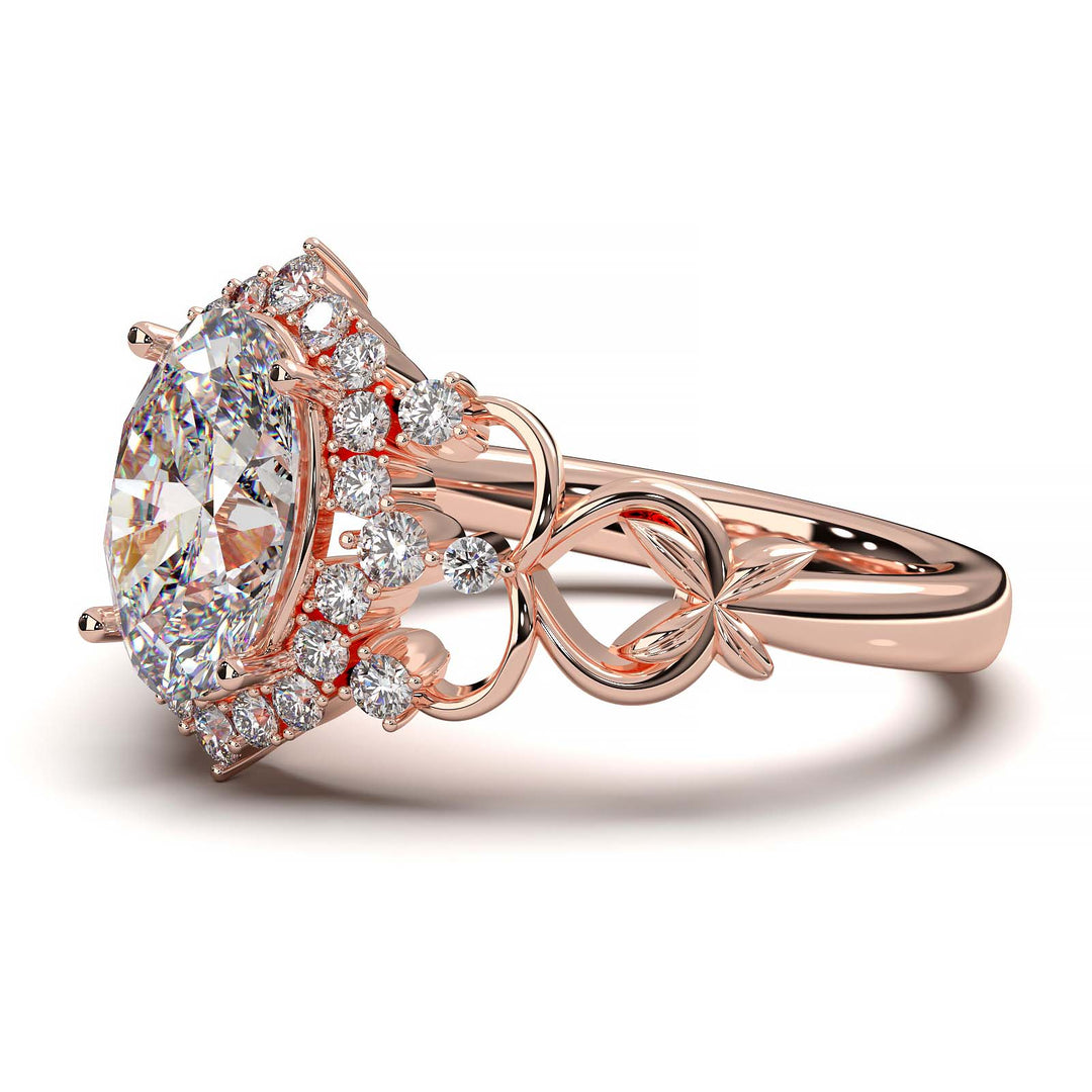 Oval-cut lab-grown diamond engagement ring with intricate vintage-inspired halo design and delicate band.