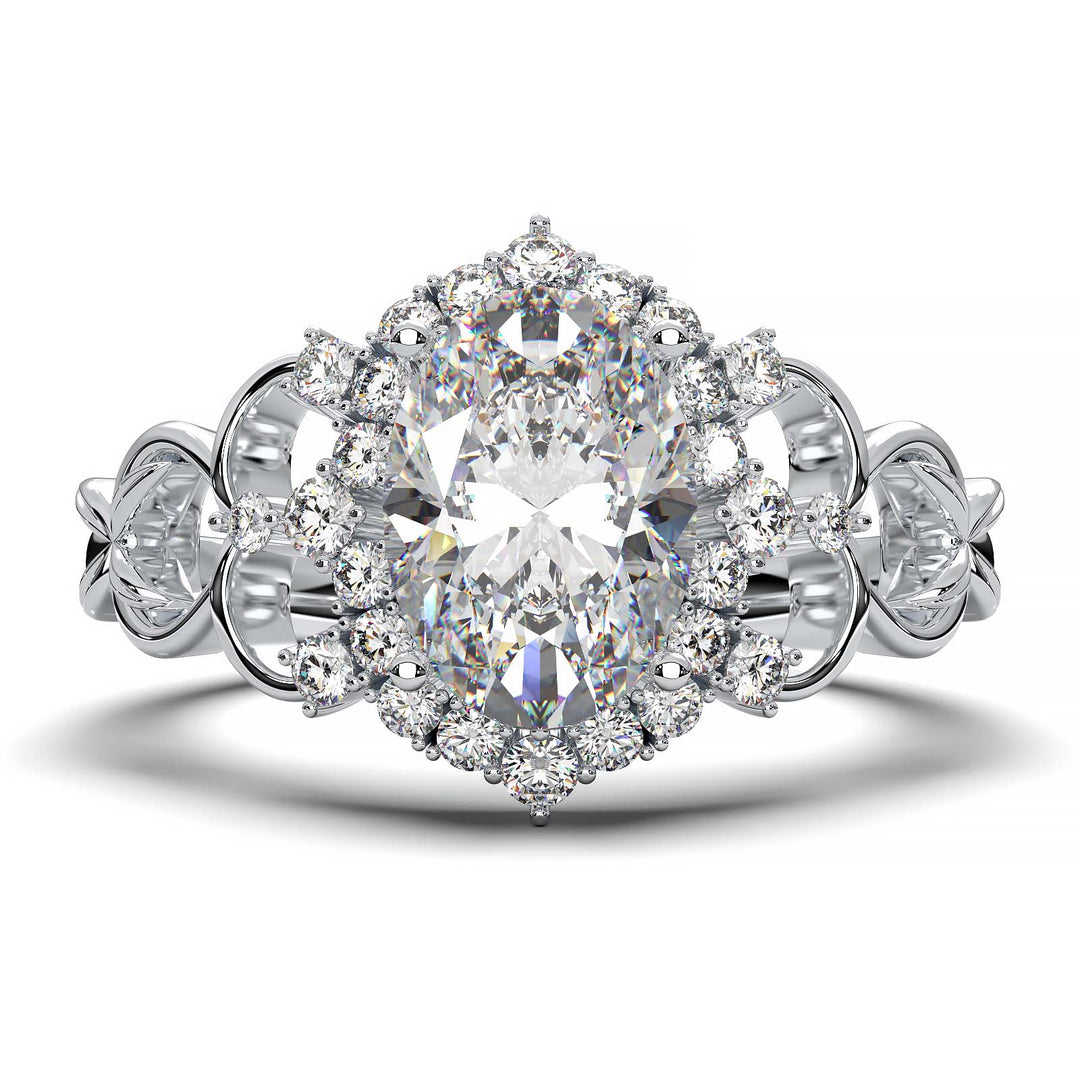 Oval-cut lab-grown diamond engagement ring with intricate vintage-inspired halo design and delicate band.