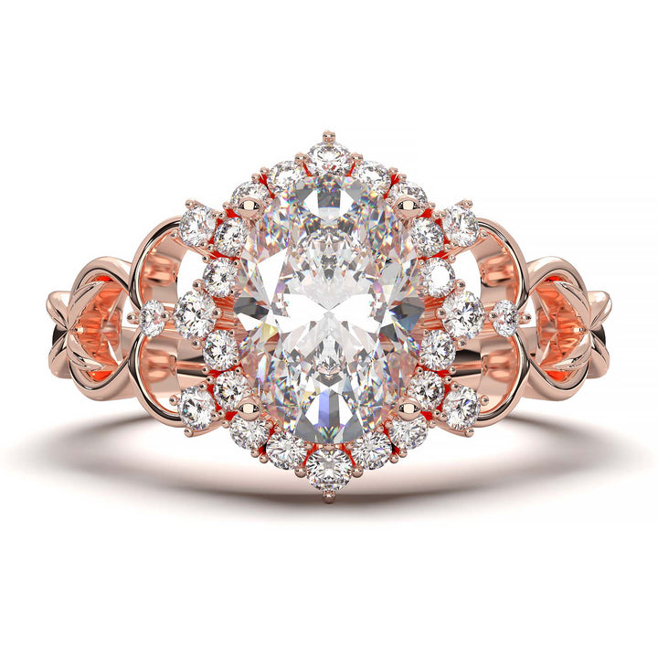 Oval-cut lab-grown diamond engagement ring with intricate vintage-inspired halo design and delicate band.