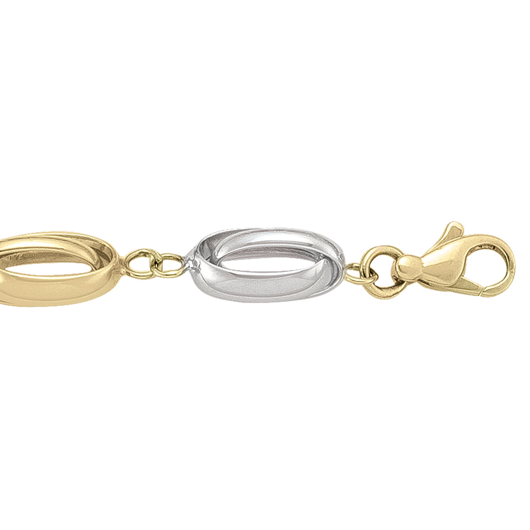 14k yellow and white gold bracelet with sleek two-tone links and a lobster clasp, 7.5 inches long.