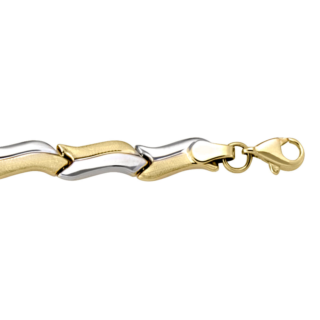 Two-tone gold bracelet with slender hollow links, featuring yellow and white gold, 7.25 inches long.