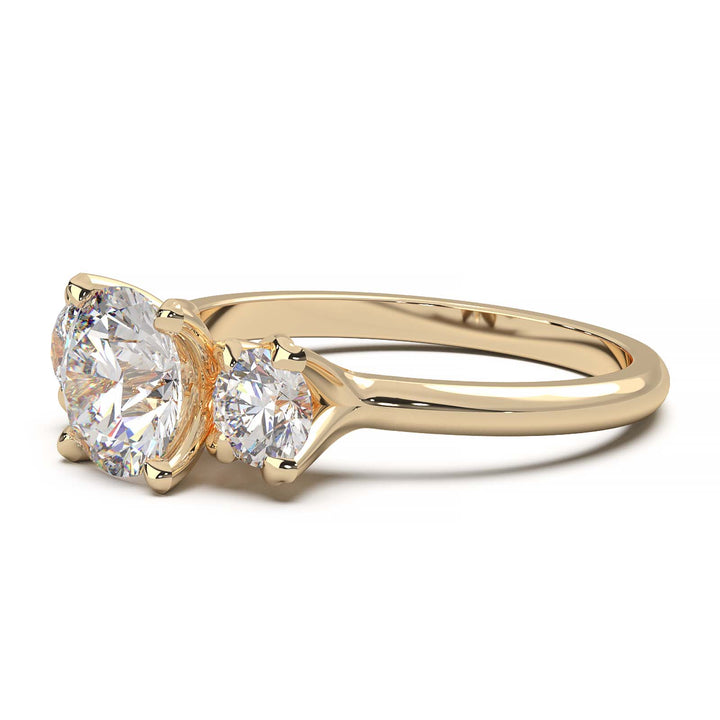 1-carat lab-grown diamond three-stone engagement ring with round-cut accents.