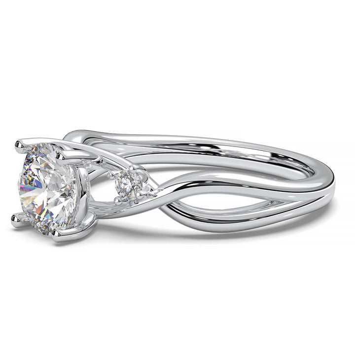 twisted engagement ring with a 0.8 carat round lab-grown diamond and two side lab-grown diamonds.