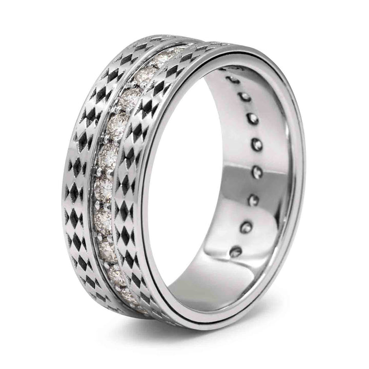 Close-up of a men's wedding band with natural diamonds and patterned sides in 14k white gold.