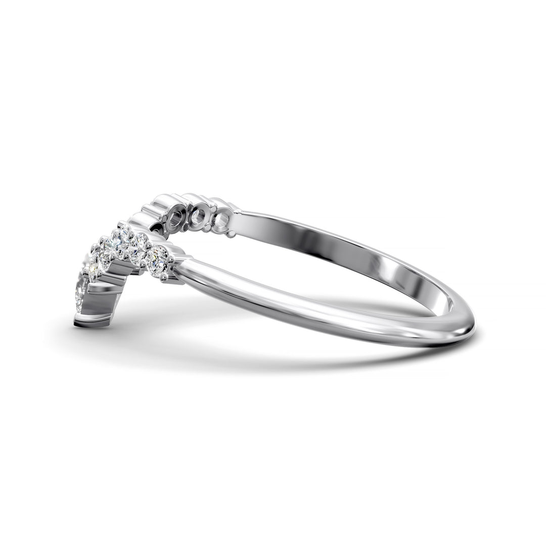 Curved V-shaped wedding band with pear center and side diamonds
