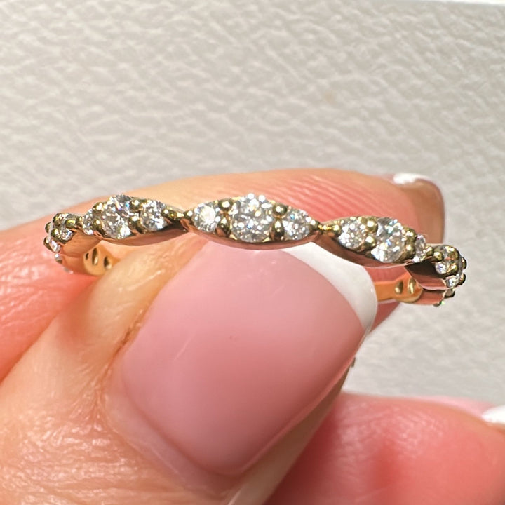 Moissanite scalloped wedding band in 14K/18K gold or platinum with round brilliant stones.