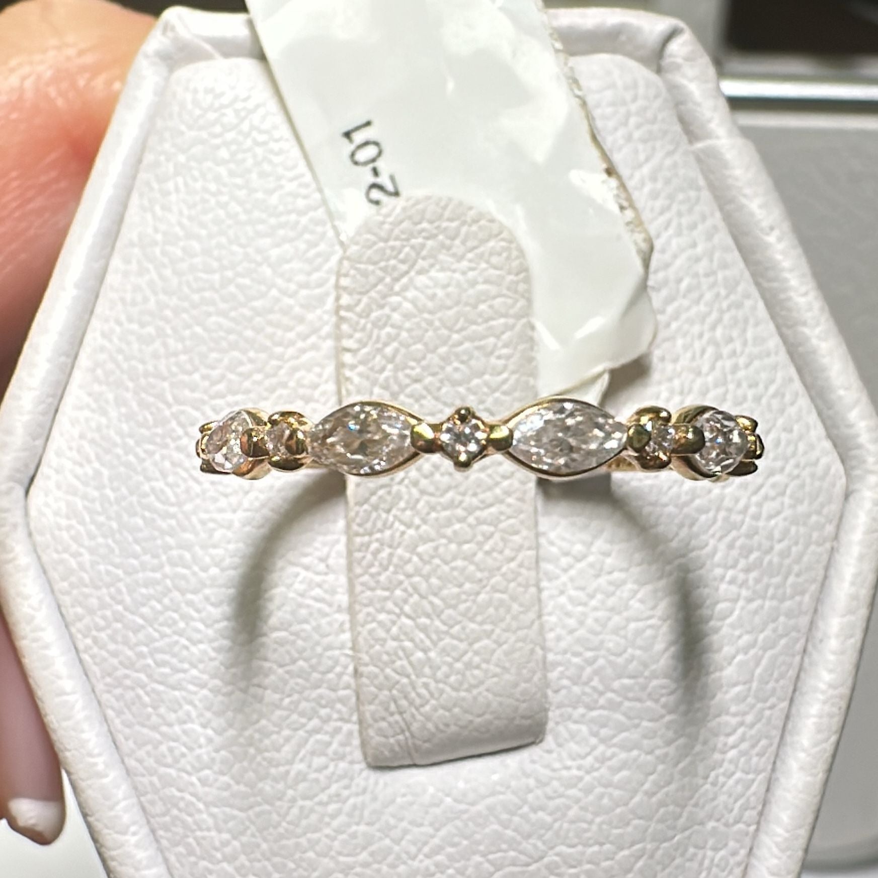 Moissanite wedding band in 14K/18K gold or platinum with marquise and round-cut stones.