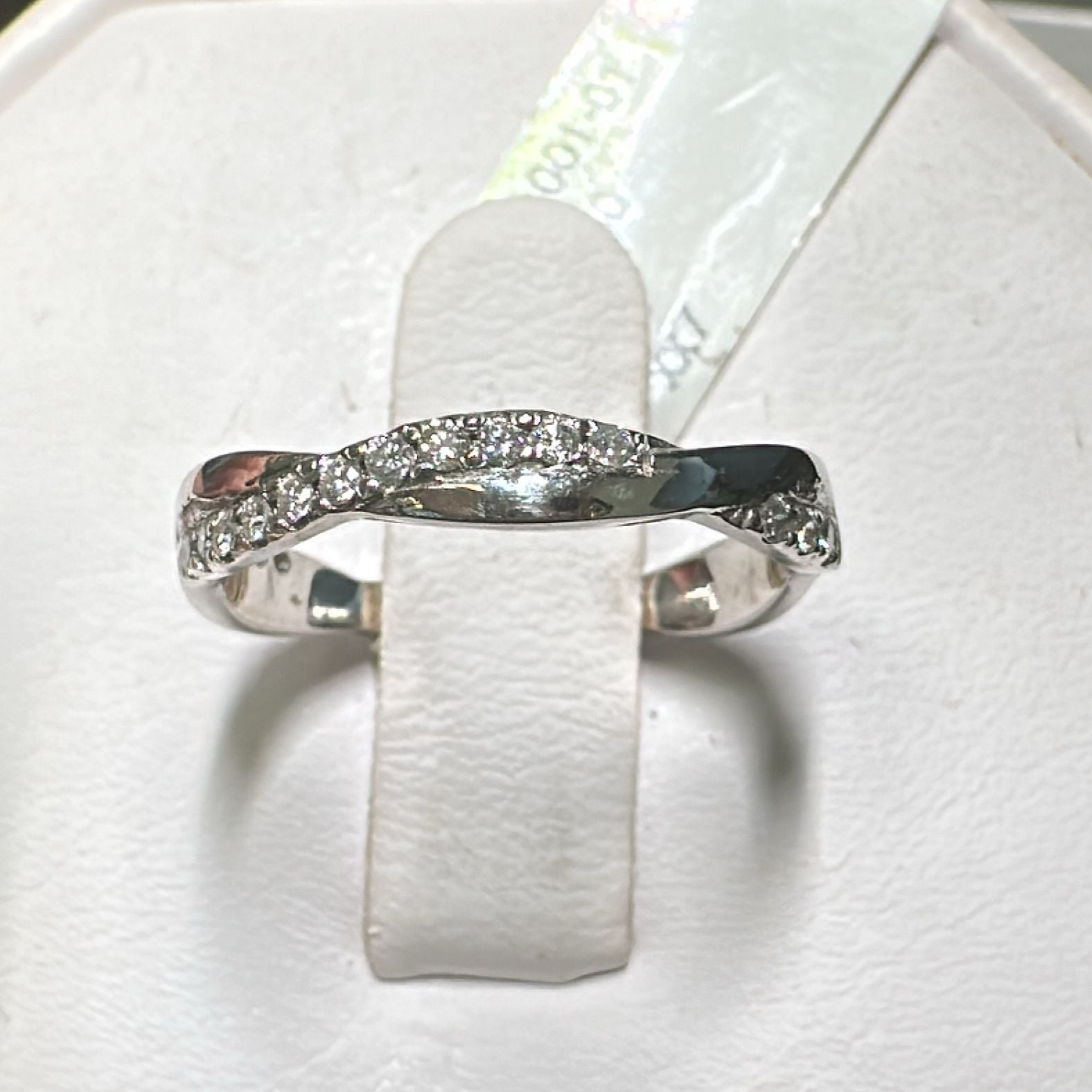 Natural diamond wedding band 0.27 Ct in 14K/18K gold or platinum with a twisted design.