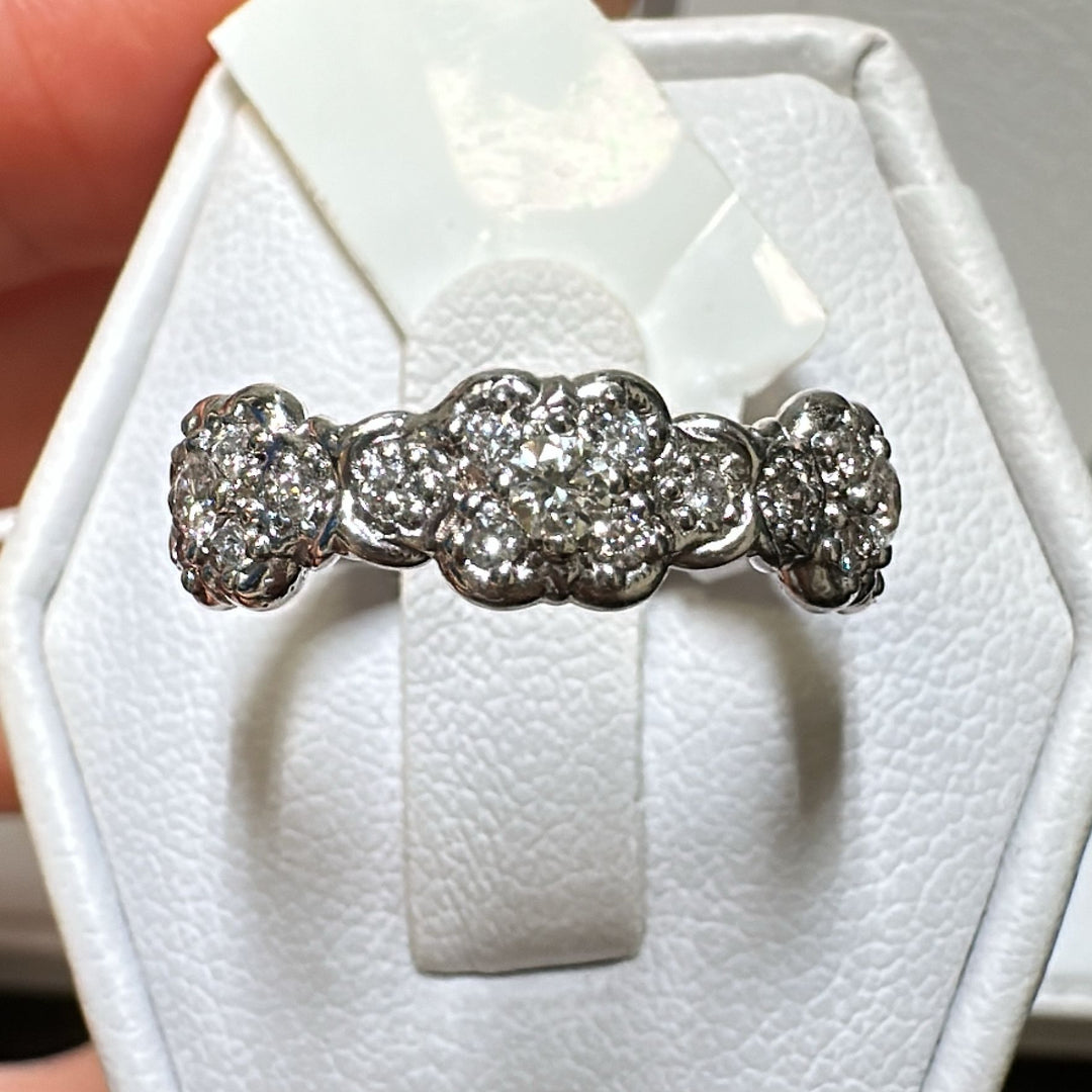 Vintage-style 14K white gold diamond anniversary band with intricate detailing.