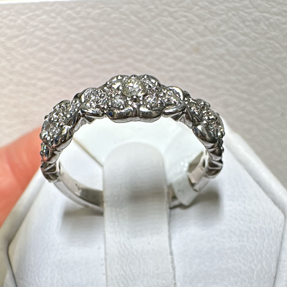 Vintage-style 14K white gold diamond anniversary band with intricate detailing.