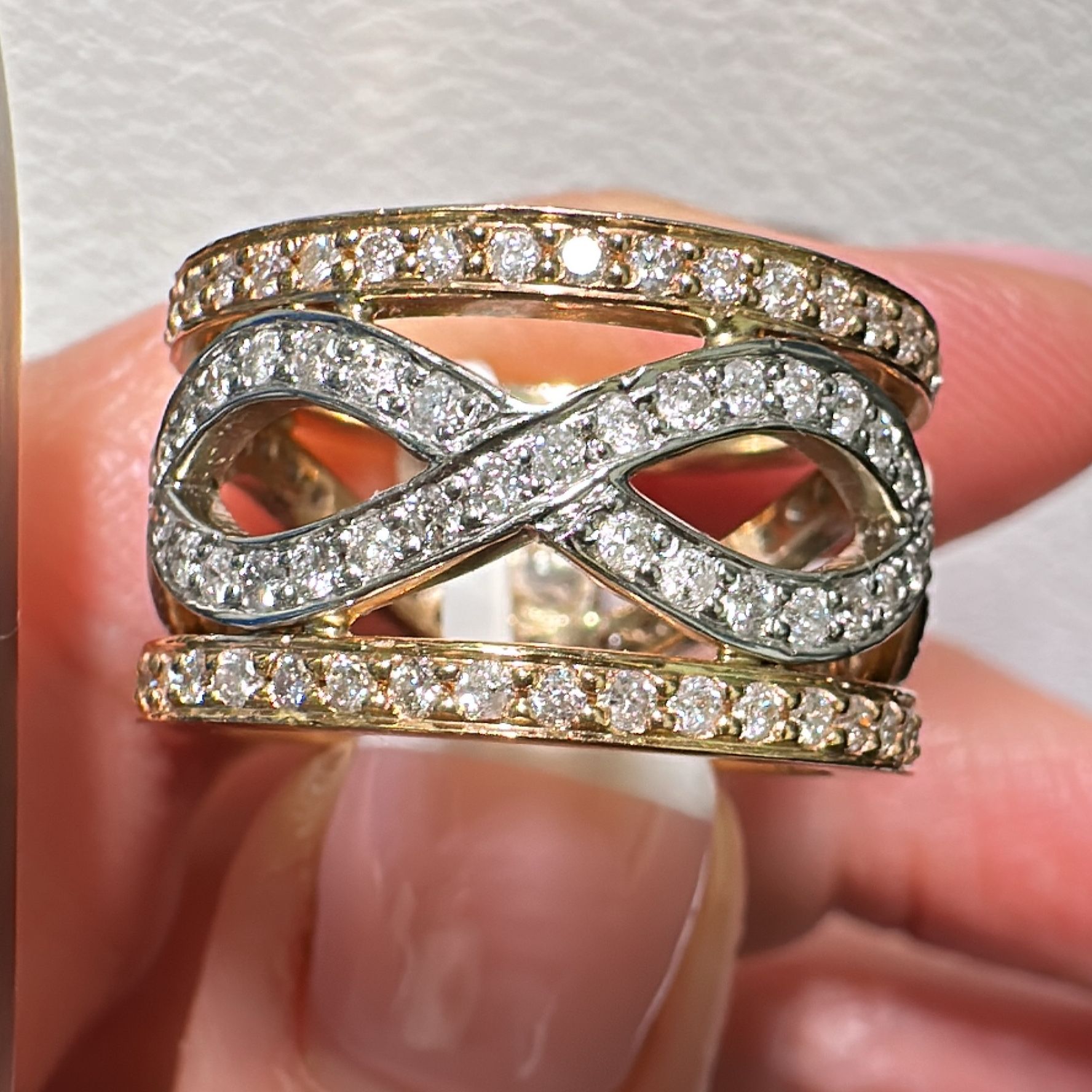 14K gold infinity anniversary ring with 1.62 CT diamonds and a bold design.