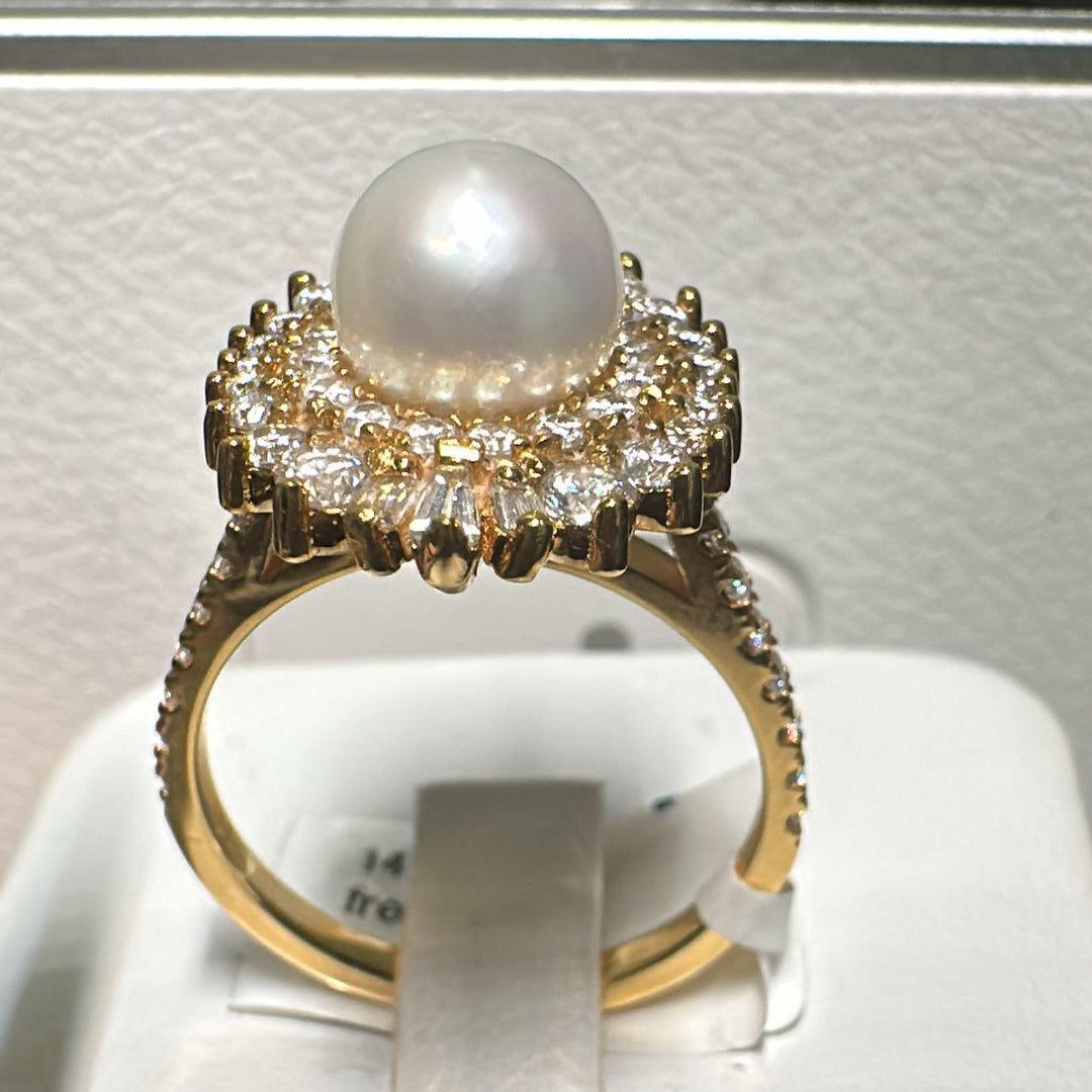 14K gold freshwater pearl ring with moissanite halo in a vintage-inspired design.