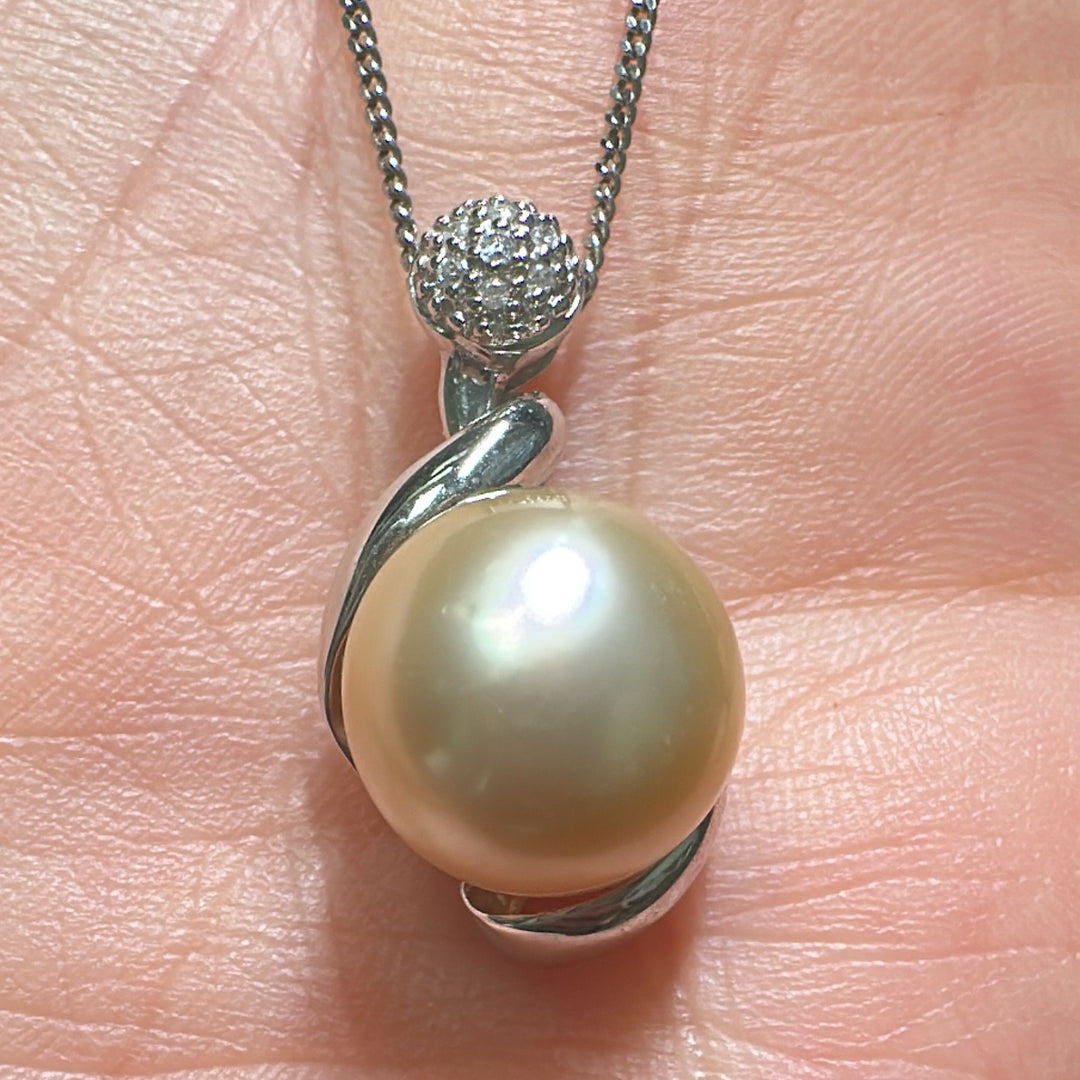 12mm Golden South Sea pearl pendant in 14K white gold with diamond accents.