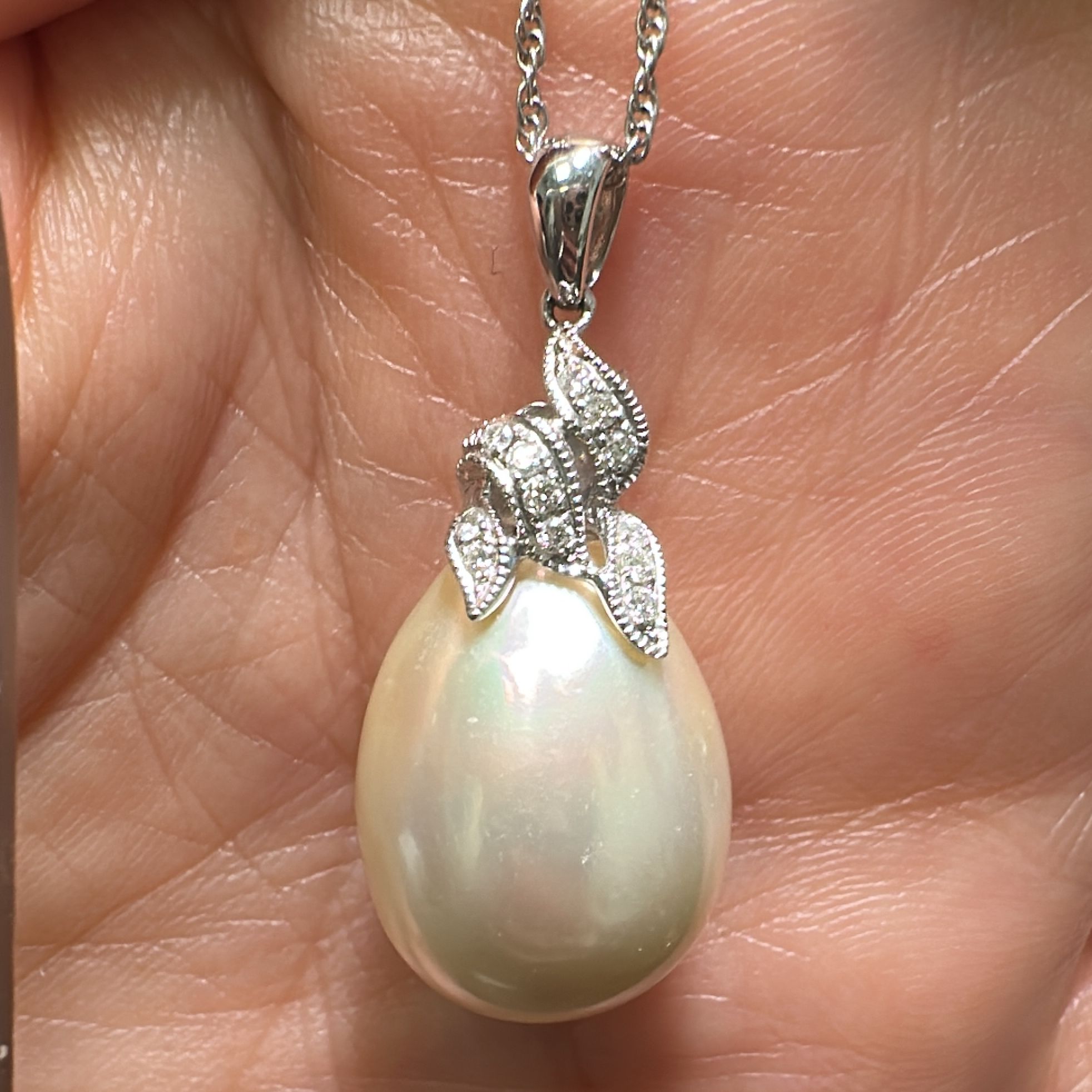 14.2mm South Sea drop pearl pendant in 14K white gold with champagne overtone and diamonds.