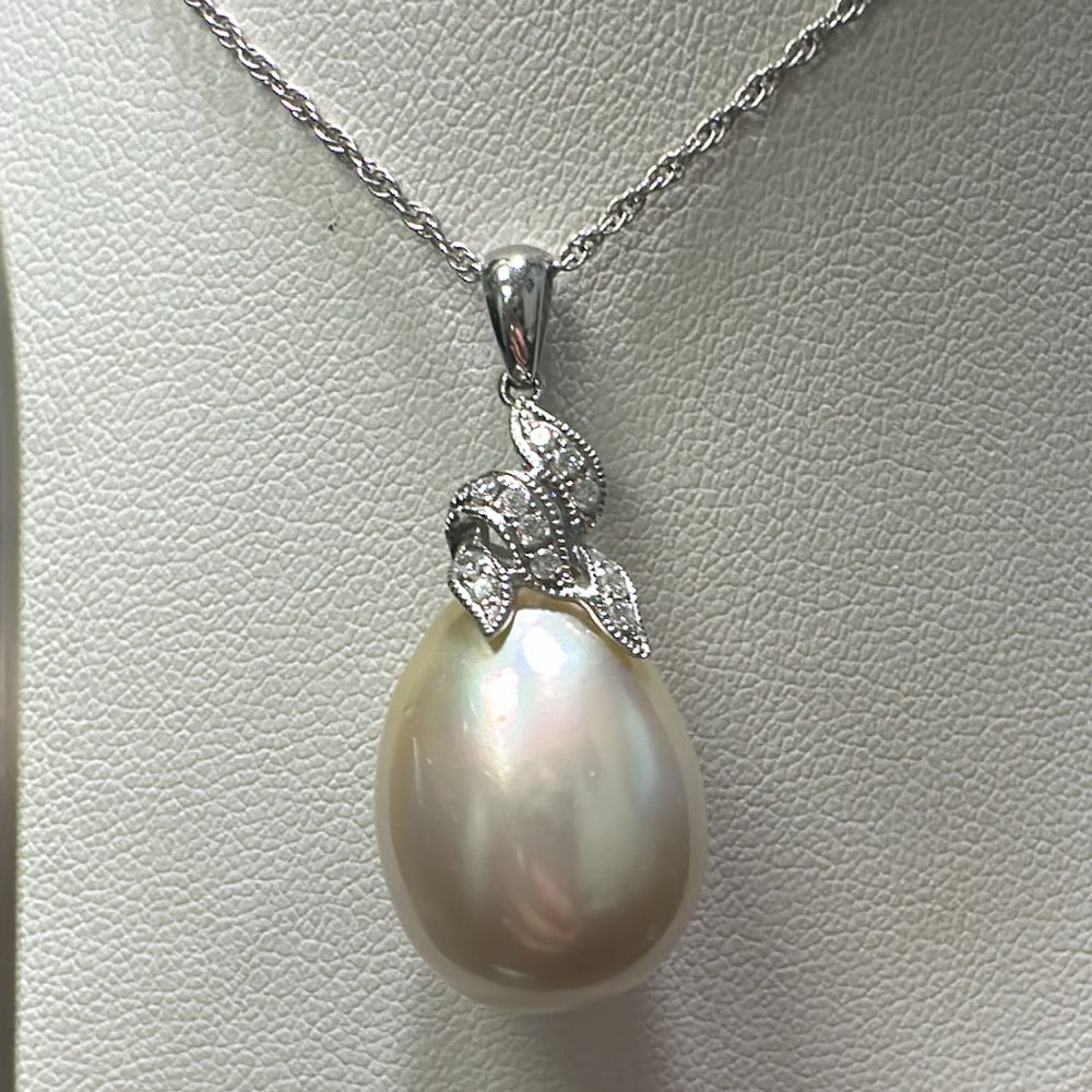 14.2mm South Sea drop pearl pendant in 14K white gold with champagne overtone and diamonds.