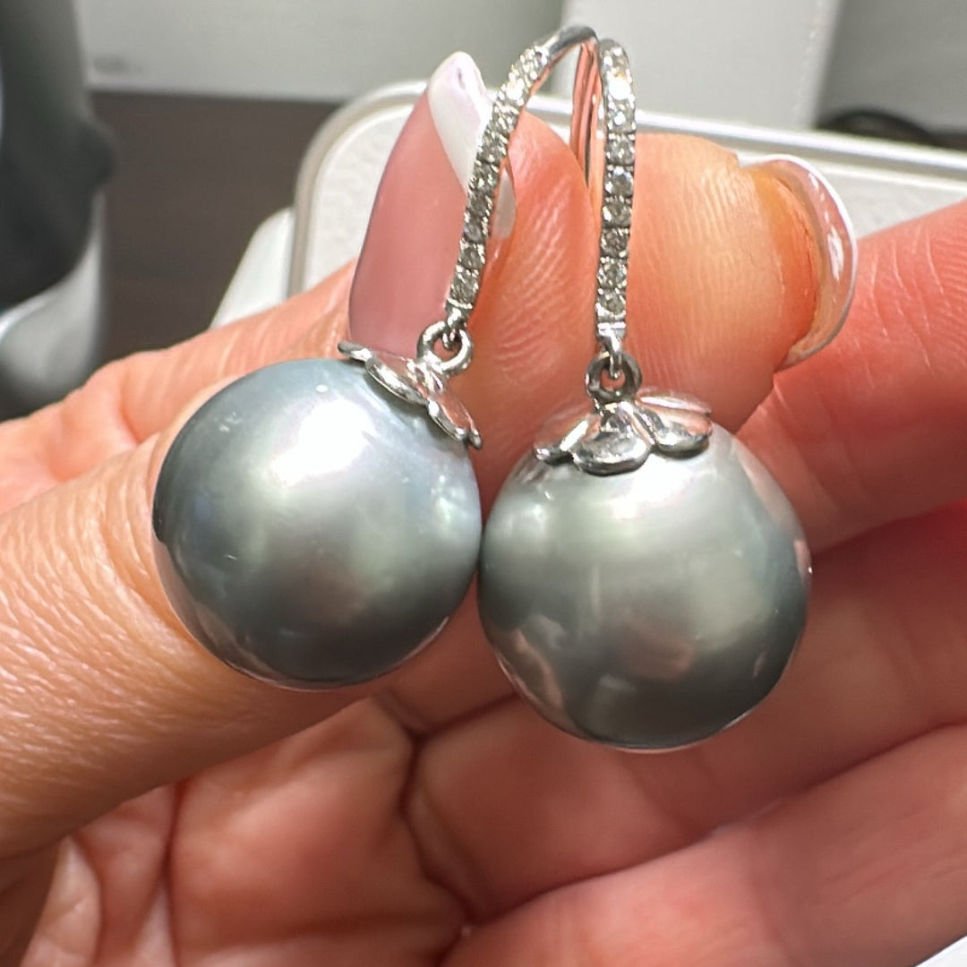 14.6mm AA round Tahitian pearl earrings in 14K white gold with diamond accents.