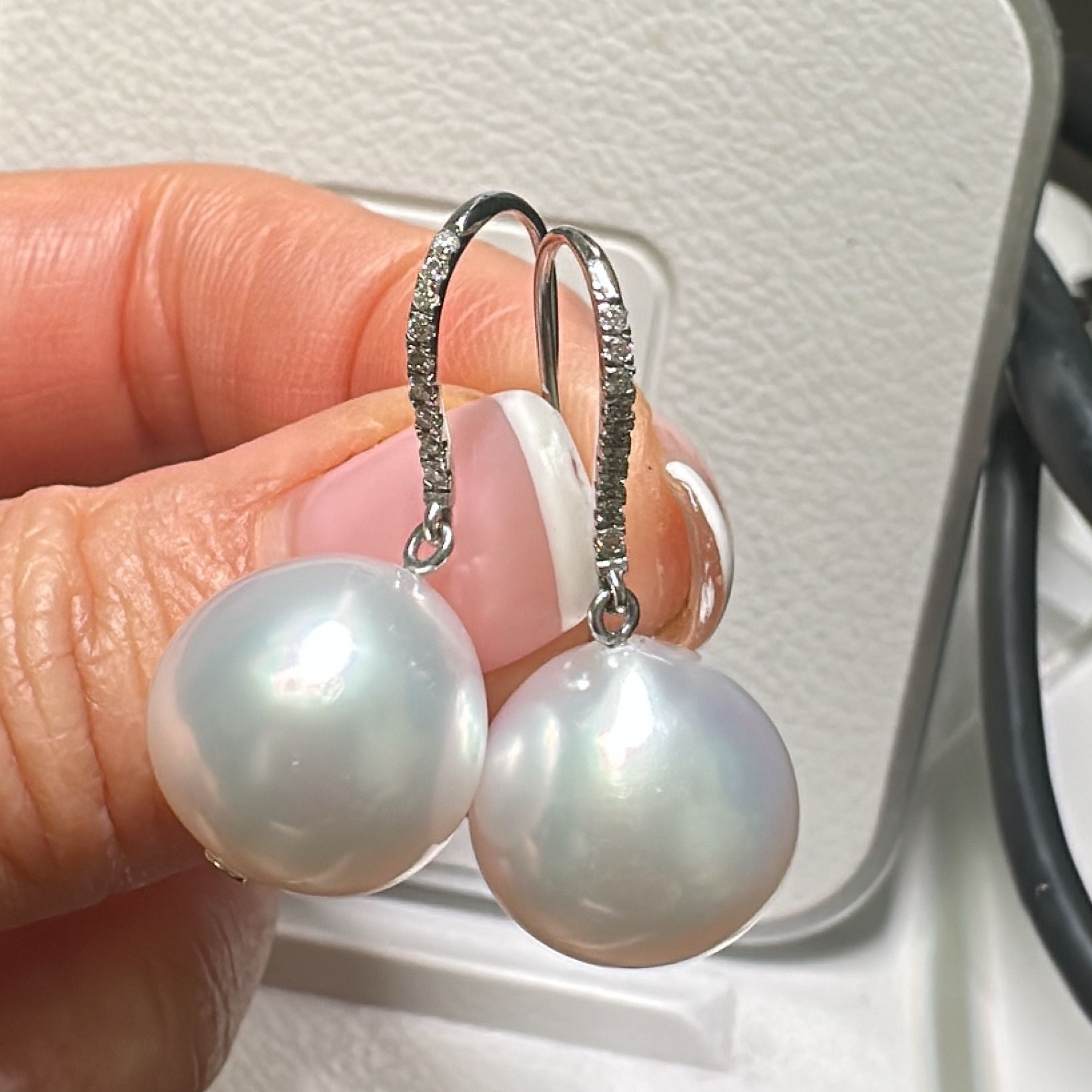 13.8mm AAA White South Sea pearl earrings in 14K white gold with diamond accents.