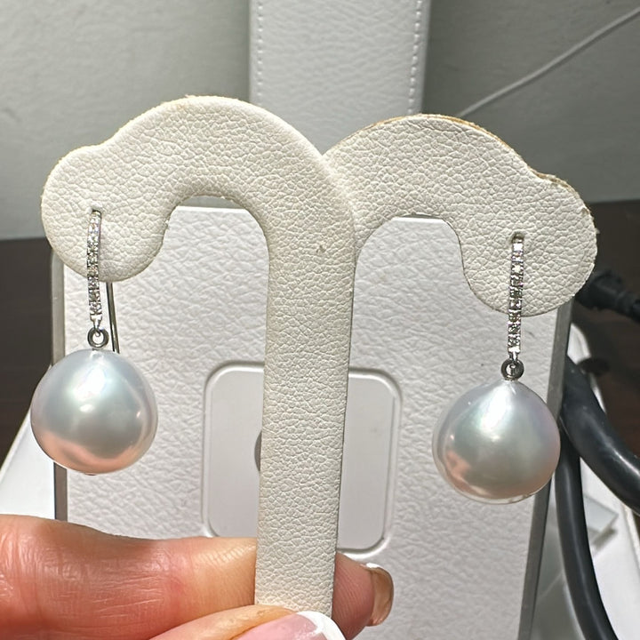 13.8mm AAA White South Sea pearl earrings in 14K white gold with diamond accents.