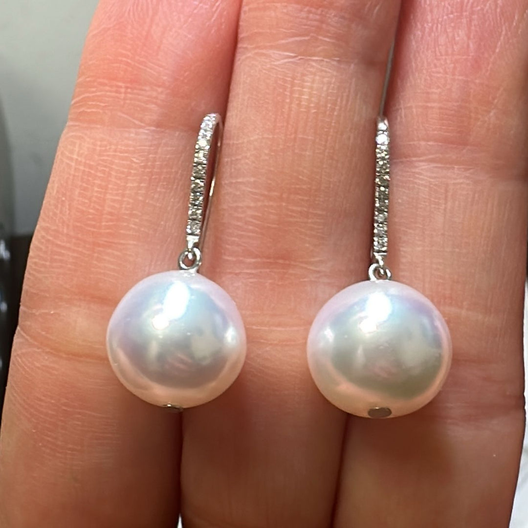 12.5mm AAA White South Sea pearl earrings in 14K white gold with diamond accents.