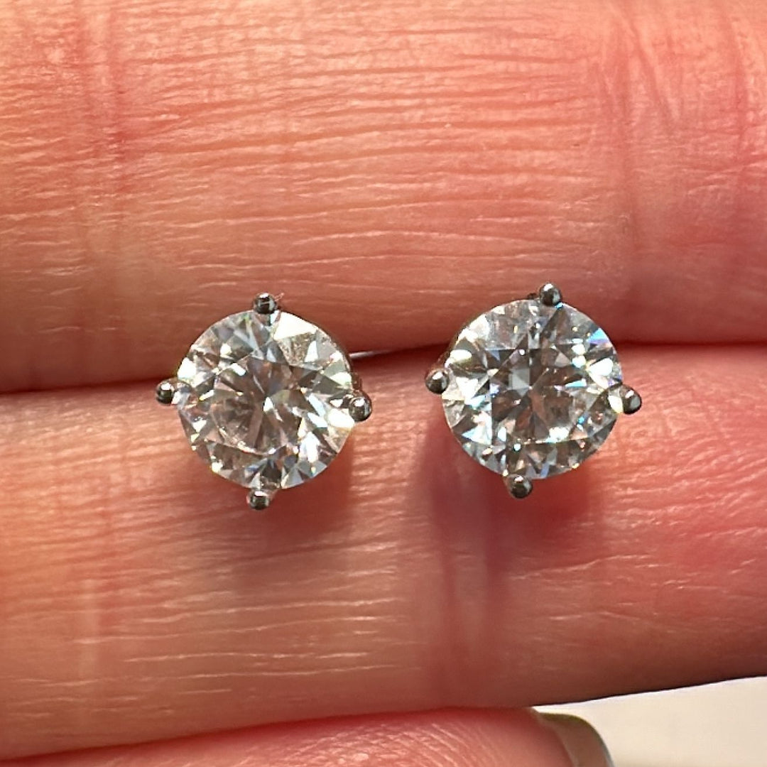 5.5mm moissanite stud earrings in 14K white gold with a classic 4-prong setting.