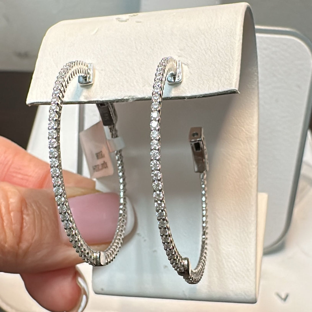 34mm moissanite hoop earrings in 14K white gold with a secure lock closure.